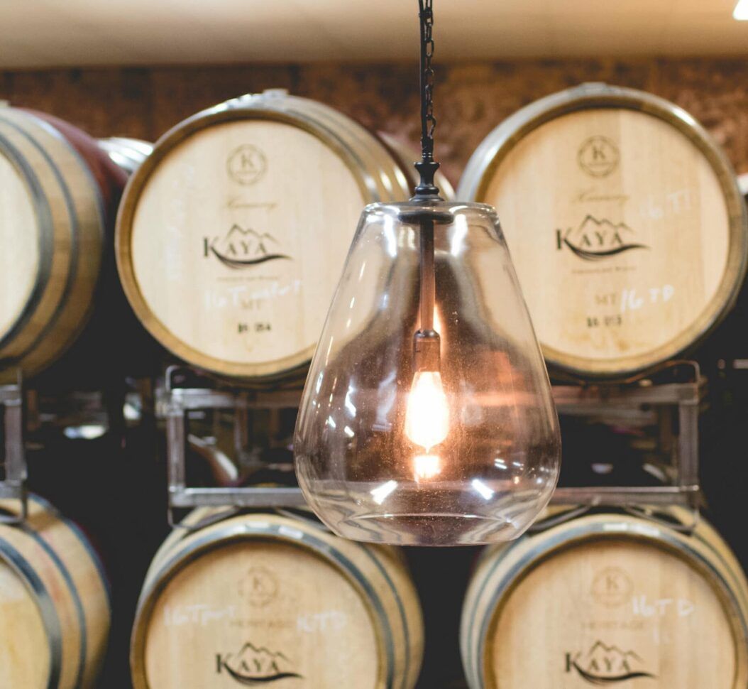 A row of wooden barrels with the letter k on them