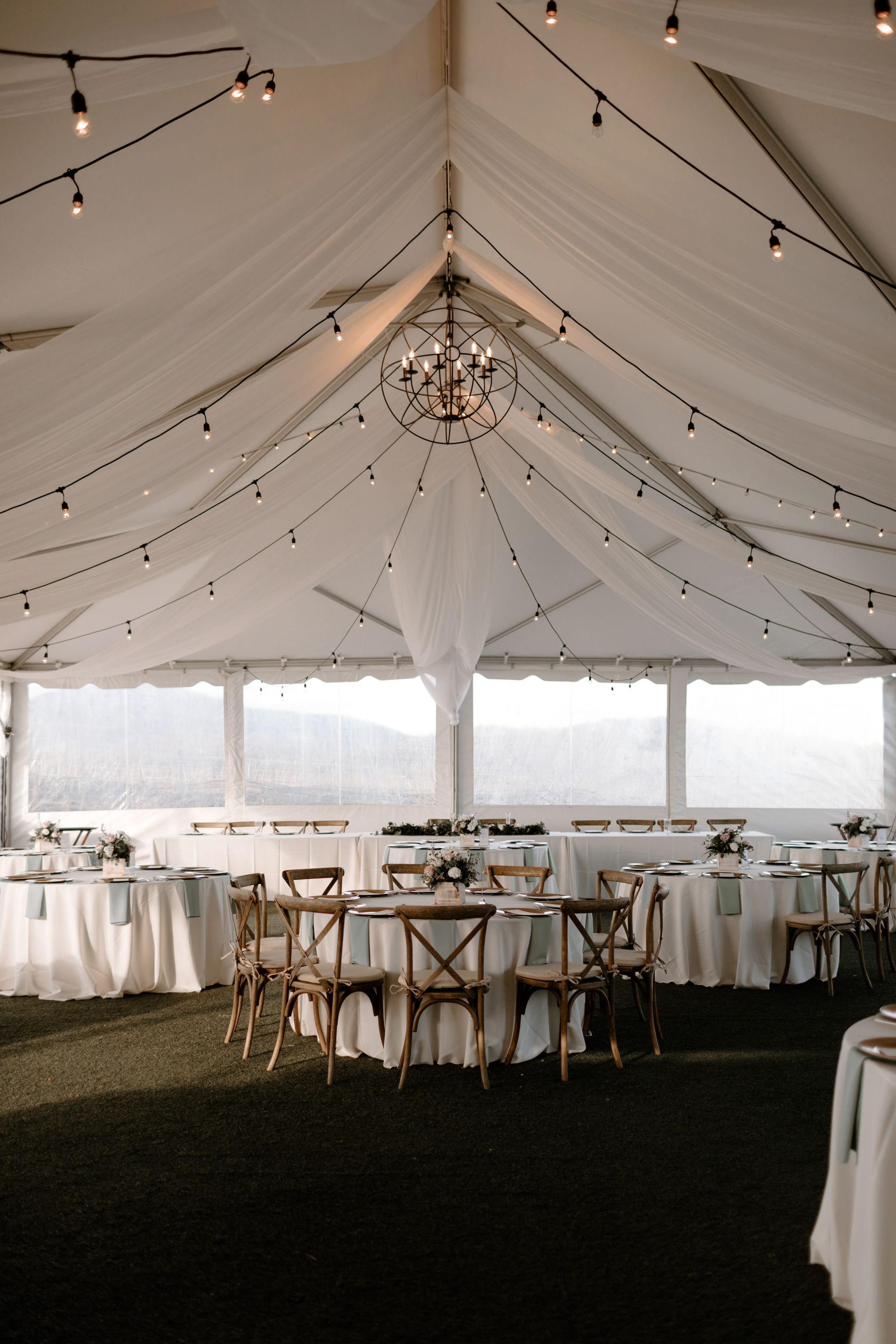 A wooden bar with bottles of wine and drinks on it.