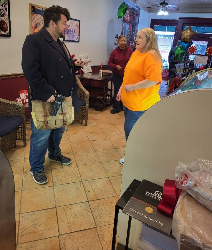 Box of assorted chocolate truffles with various drizzles and toppings.