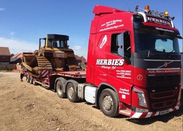 Herbie's haulage vehicle carrying the heavy machinery