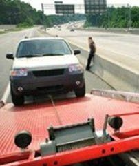 SUV Being Loaded onto Tow Truck - Roadside Assistance in Erie, PA