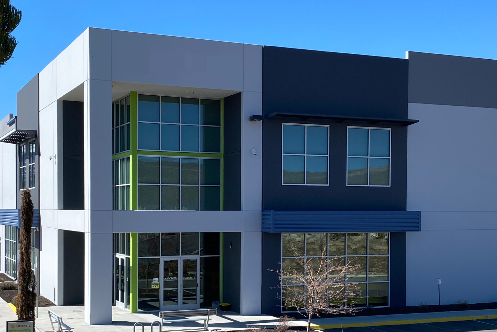 A building with a lot of windows and a green door