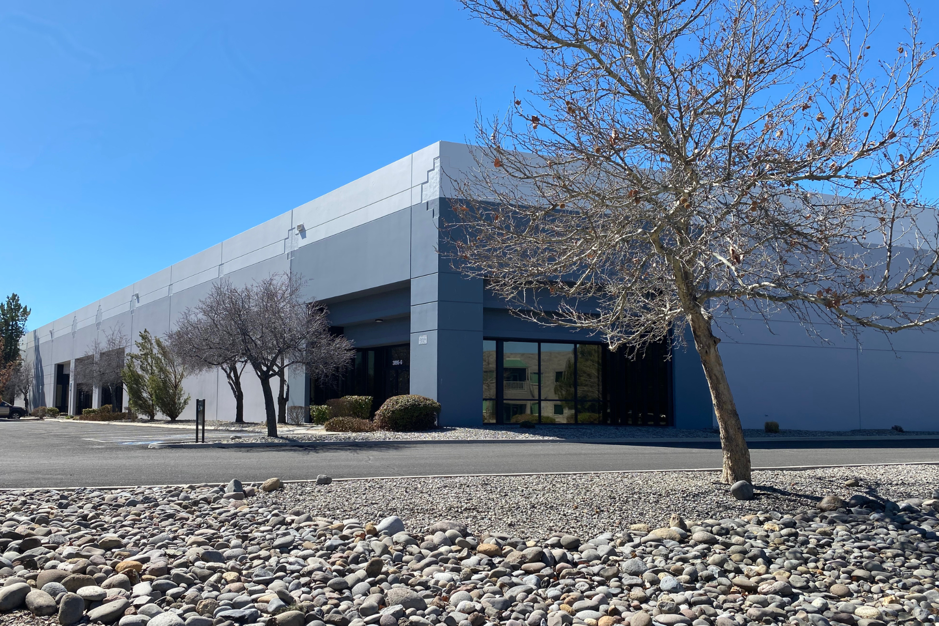 A large building with a tree in front of it
