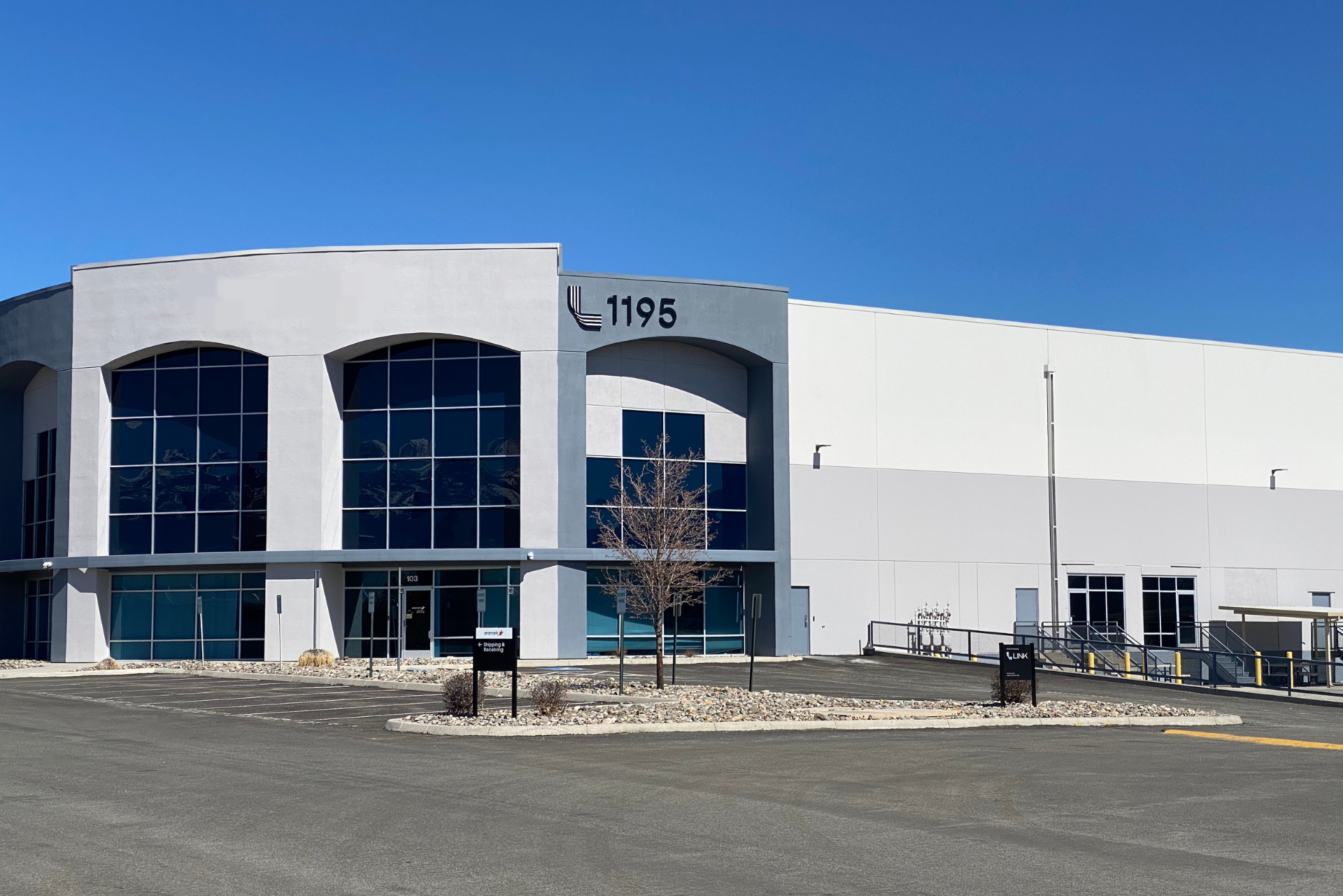 A large white building with the number 1195 on the side