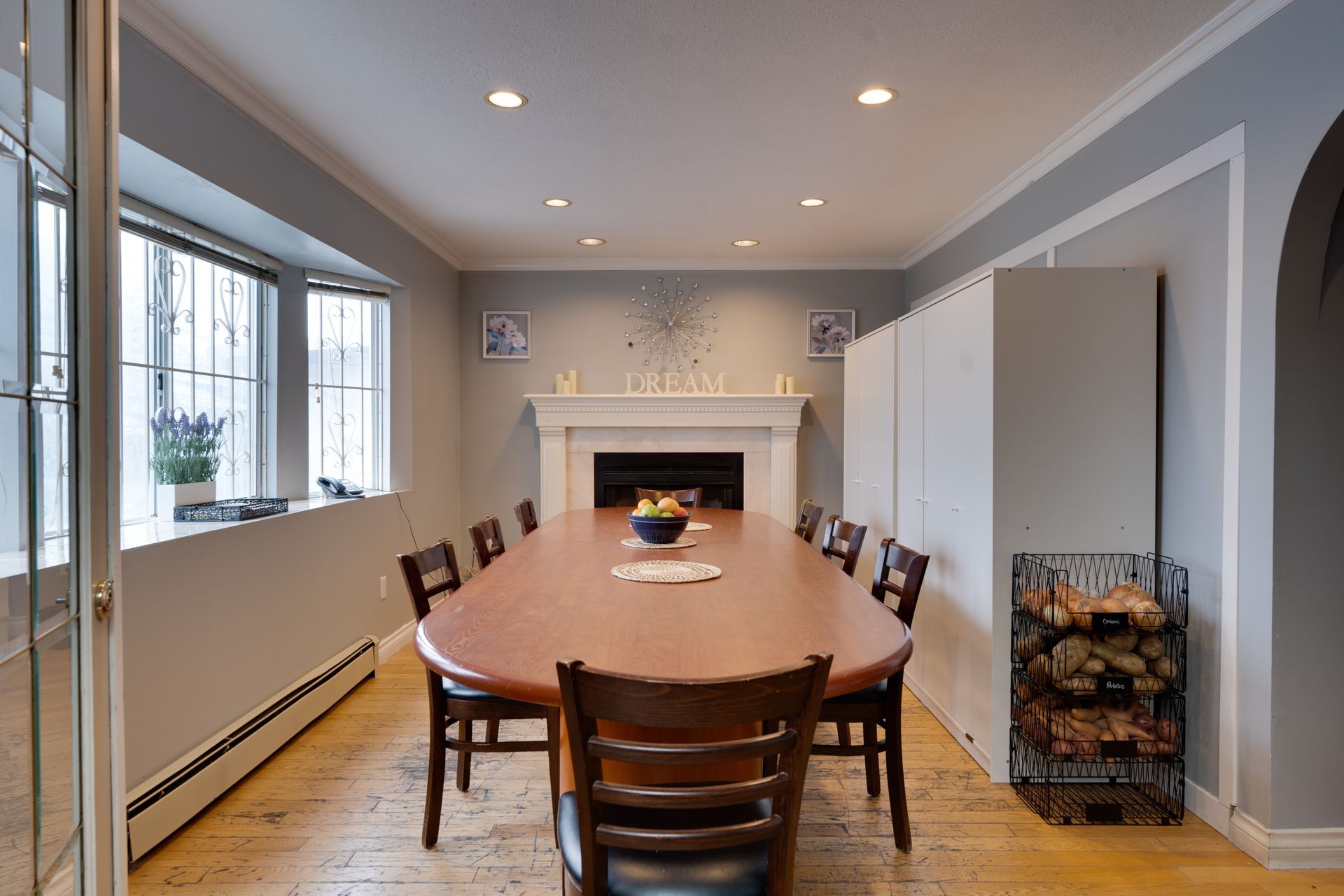 A living room with a couch , coffee table , and bookshelf.