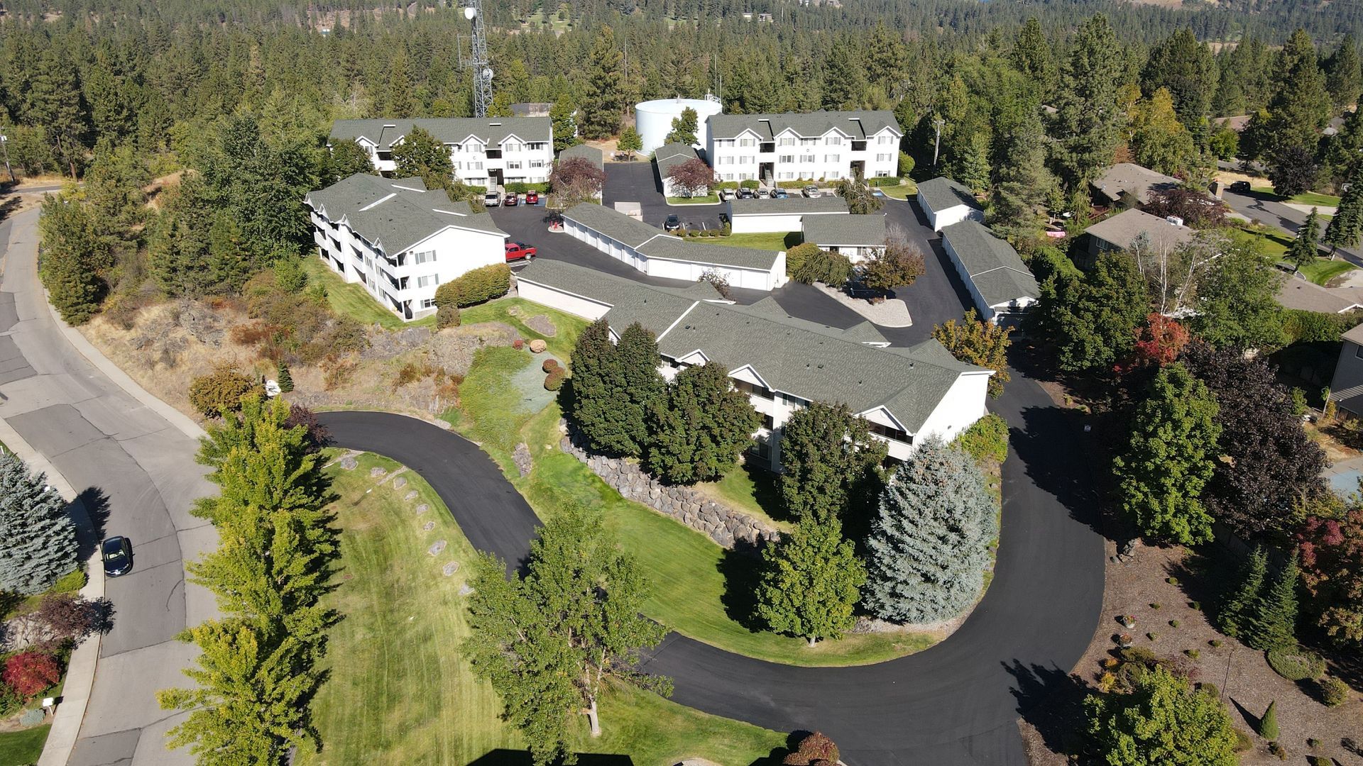 An aerial view of a large house in a residential area