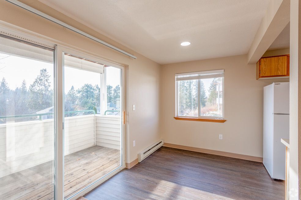 A living room with sliding glass doors leading to a balcony.
