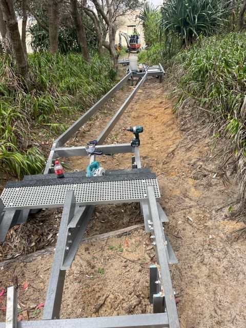 A long, galvanized metal track — Environment Restoration Solutions in Waterview Heights, NSW