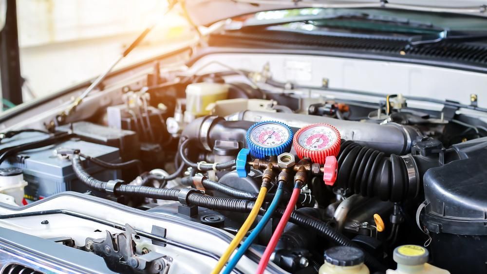 A Close up Of a Car Engine with Gauges Attached to It — Belmont Auto Electrics in Belmont, NSW