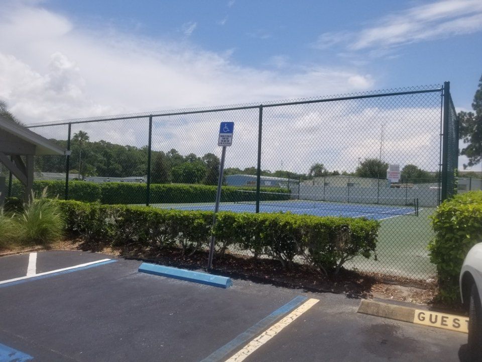 Black Vinyl Coated Chainlink fence around a tennis court