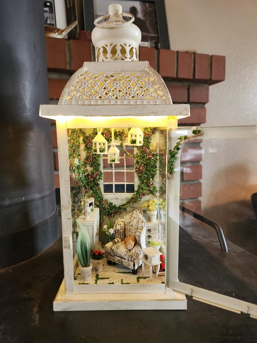 A lantern with a living room inside of it