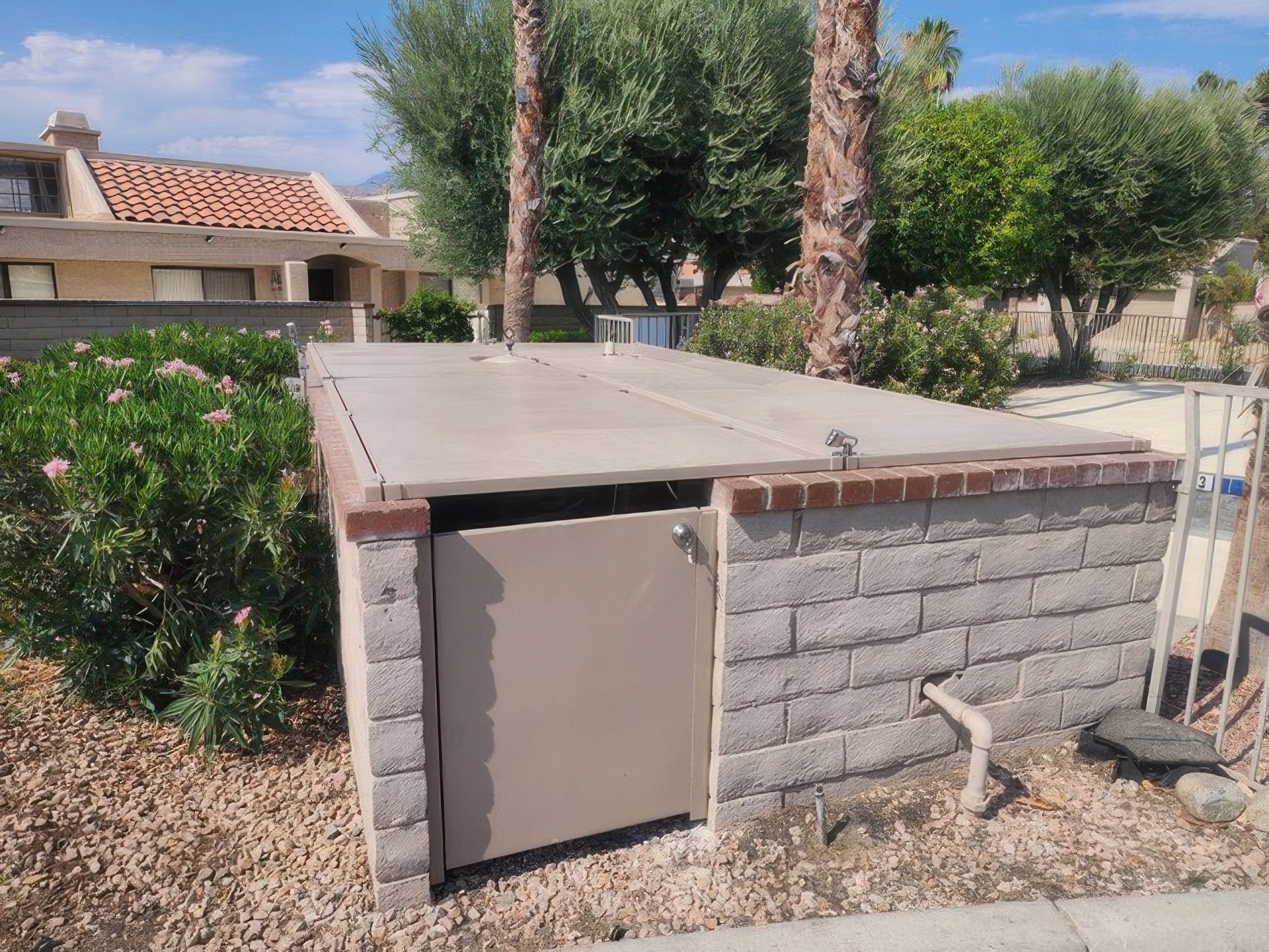 A brick building with a roof and a door