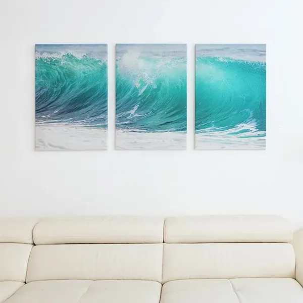 Triple canvas print on living room wall