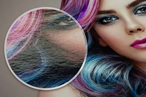 Close-up of a woman's face with vibrant, colorful hair printed on Fujicolor Glossy paper. A magnified section highlights the papers texture.