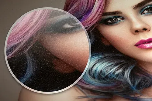 Close-up of a woman's face with vibrant, colorful hair printed on Fujicolor Luster paper. A magnified section highlights the papers texture.