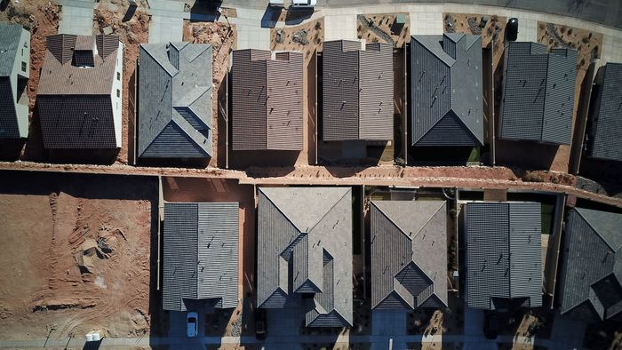 Drone view of multiple roofs installed by Riverbend Roofing