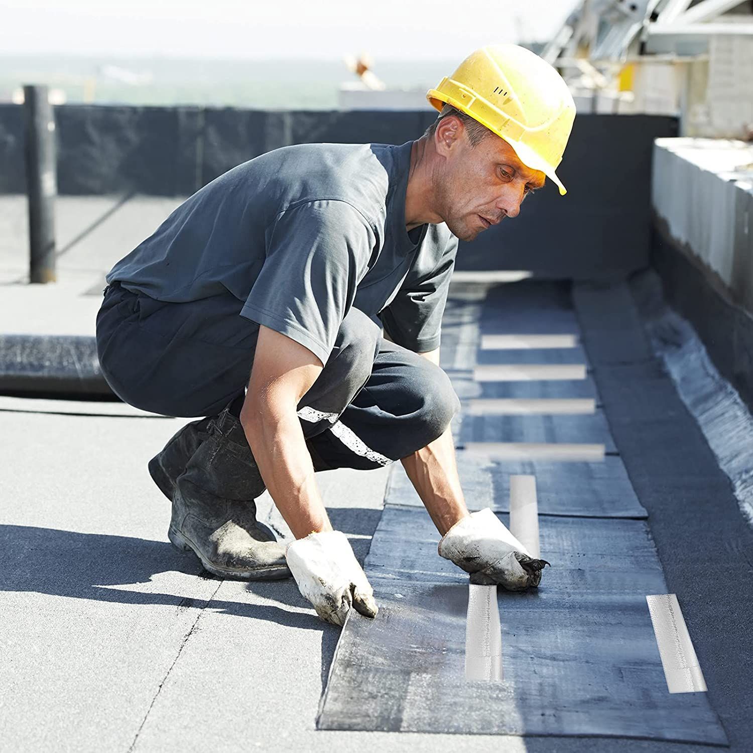 Riverbend Roofing technician performing roof repairs in Northern Utah