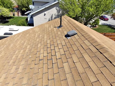 New shingle roof installed by Riverbend Roofing in a residential area