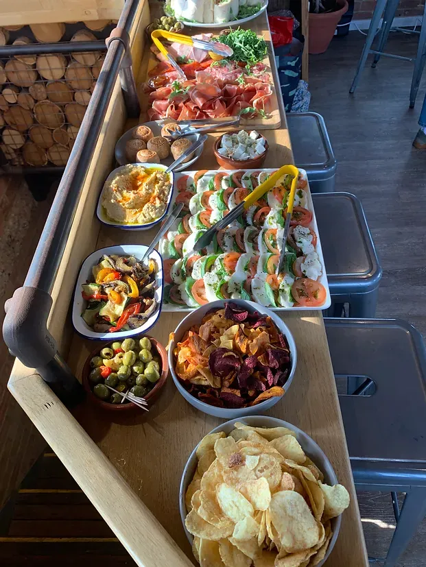 A room filled with lots of lights and balloons.Pic