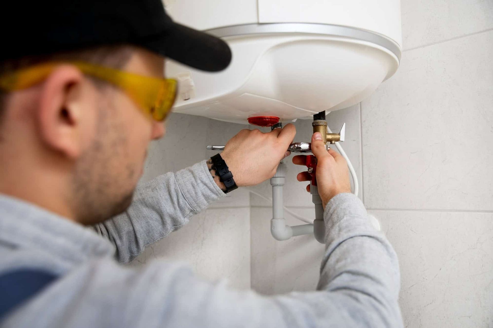 Plumber fixing water heater 