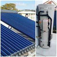 electric hot water system next to tube solar panels