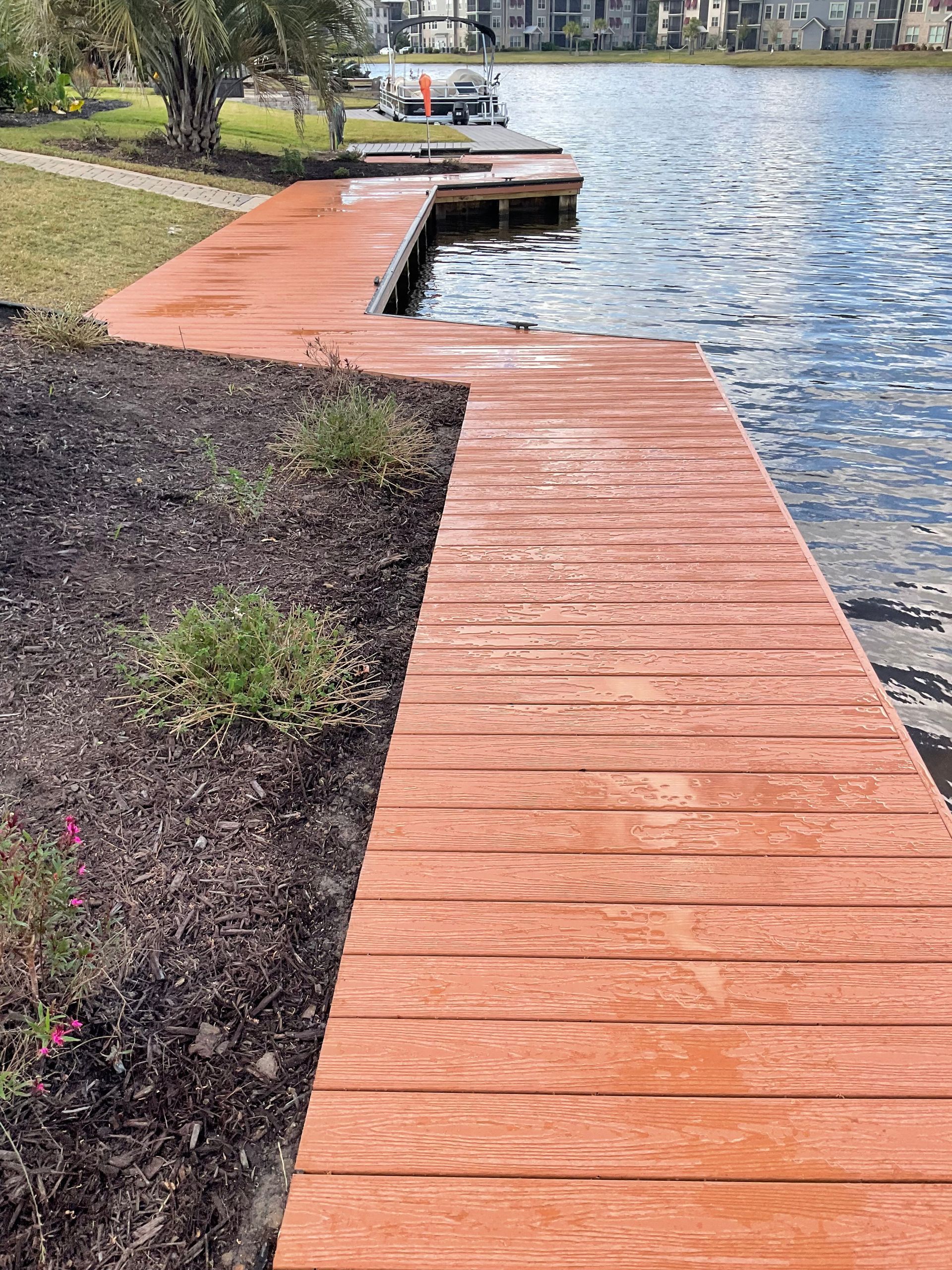 A wooden dock leading to a body of water.