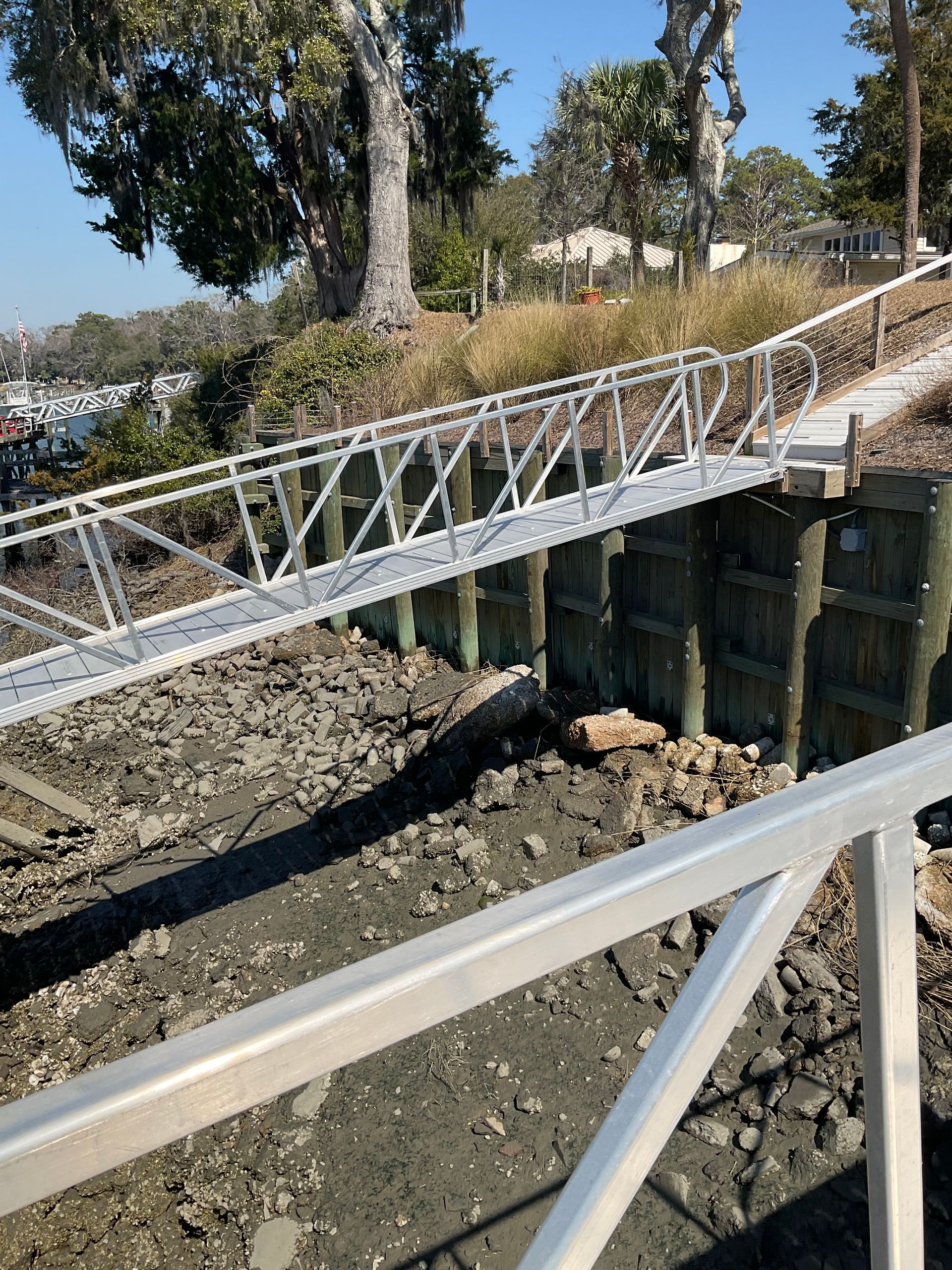 A bridge over a body of water with trees in the background