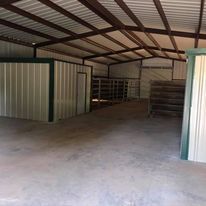 A large warehouse with a lot of pipes in it.