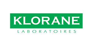 Il logo dei laboratori Klorane è verde e bianco su sfondo bianco.