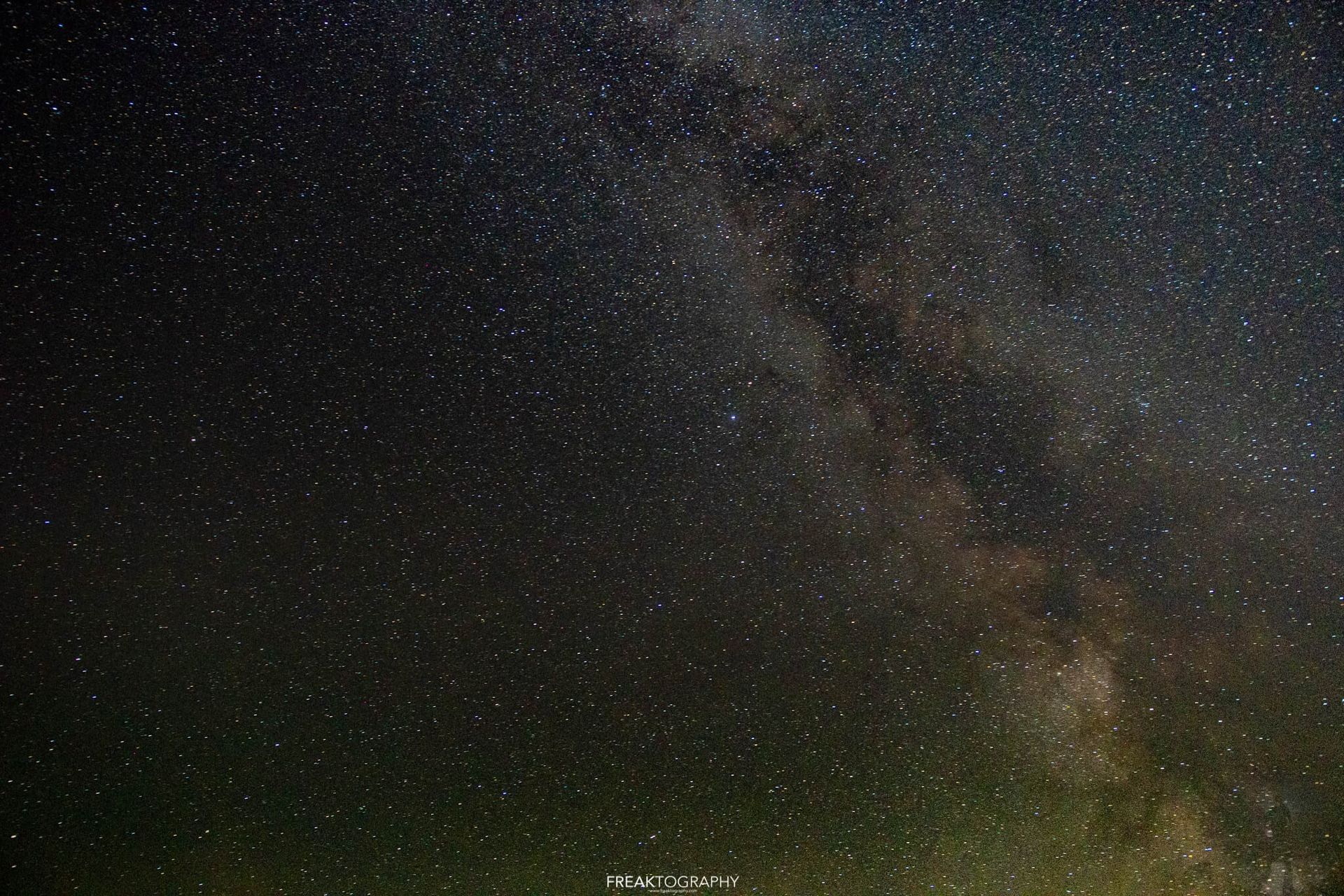 A dark night sky with a lot of stars