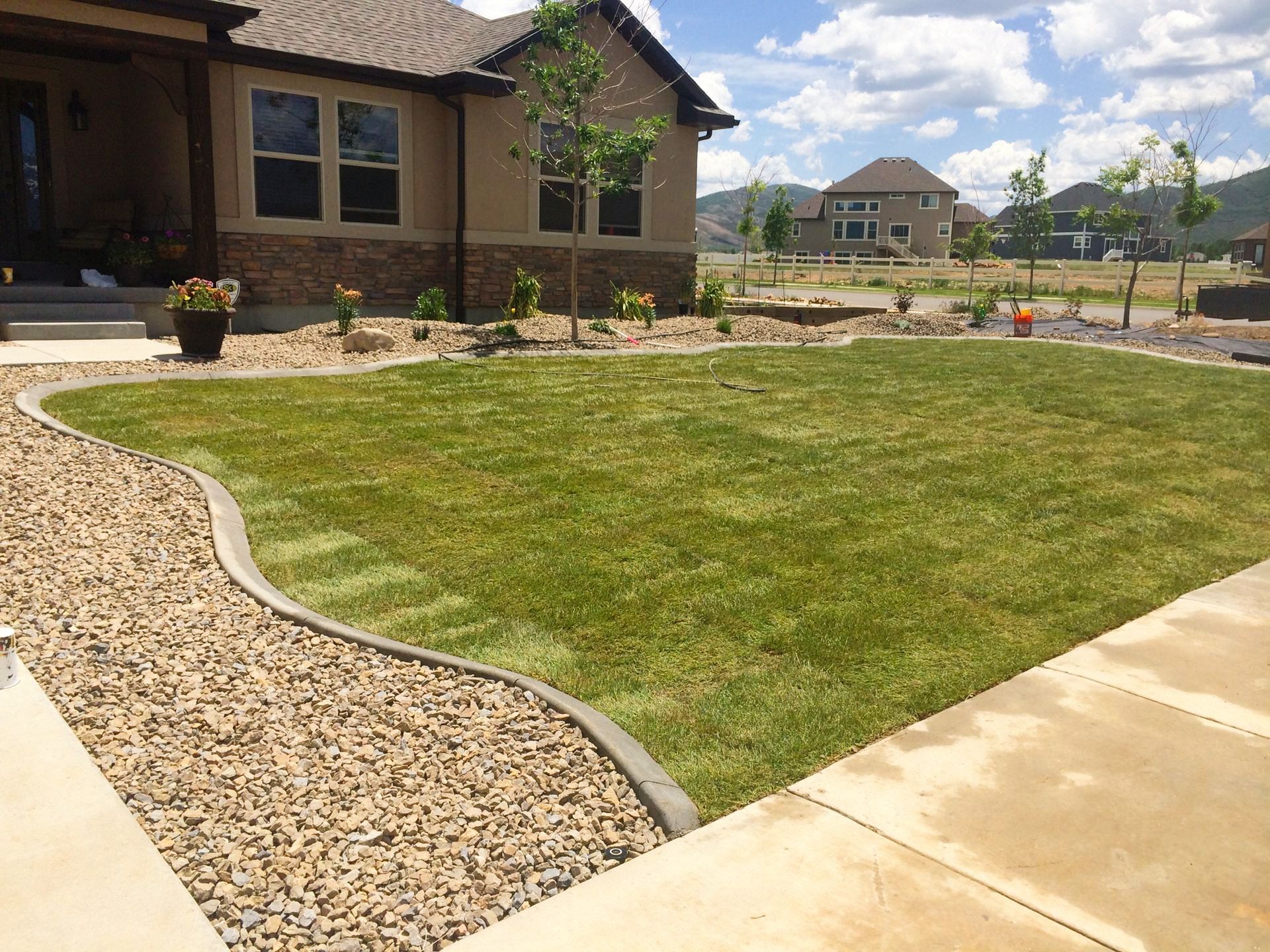 A house with a large lawn in front of it