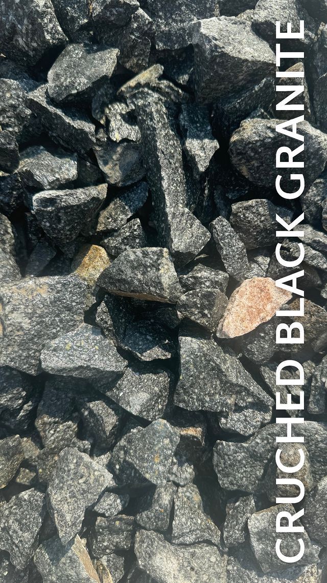 A pile of black granite rocks sitting on top of each other.