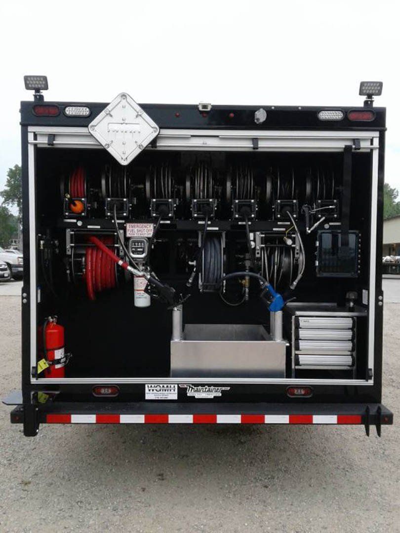 The back of a trailer with a fire extinguisher on it