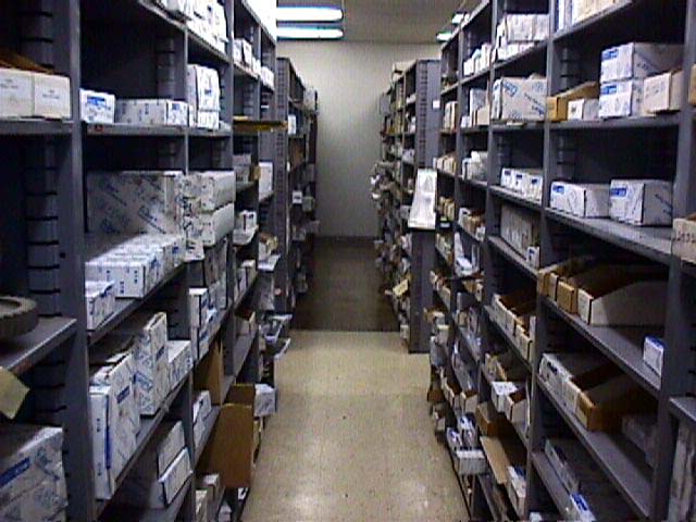 A warehouse filled with lots of boxes and shelves