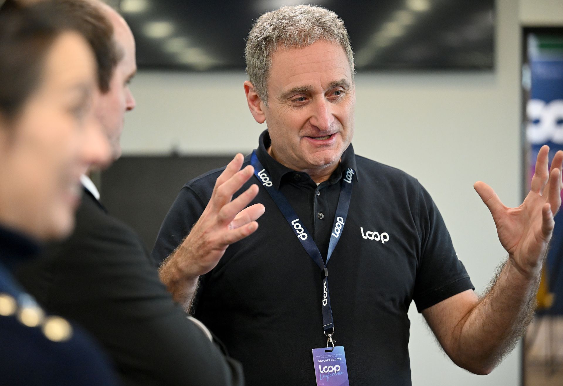 A group of people are walking down stairs in an office.