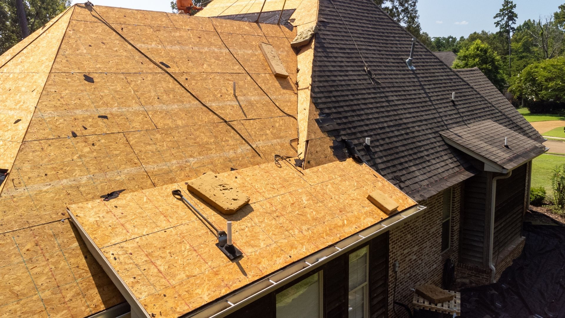 A house with a roof that is being repaired.