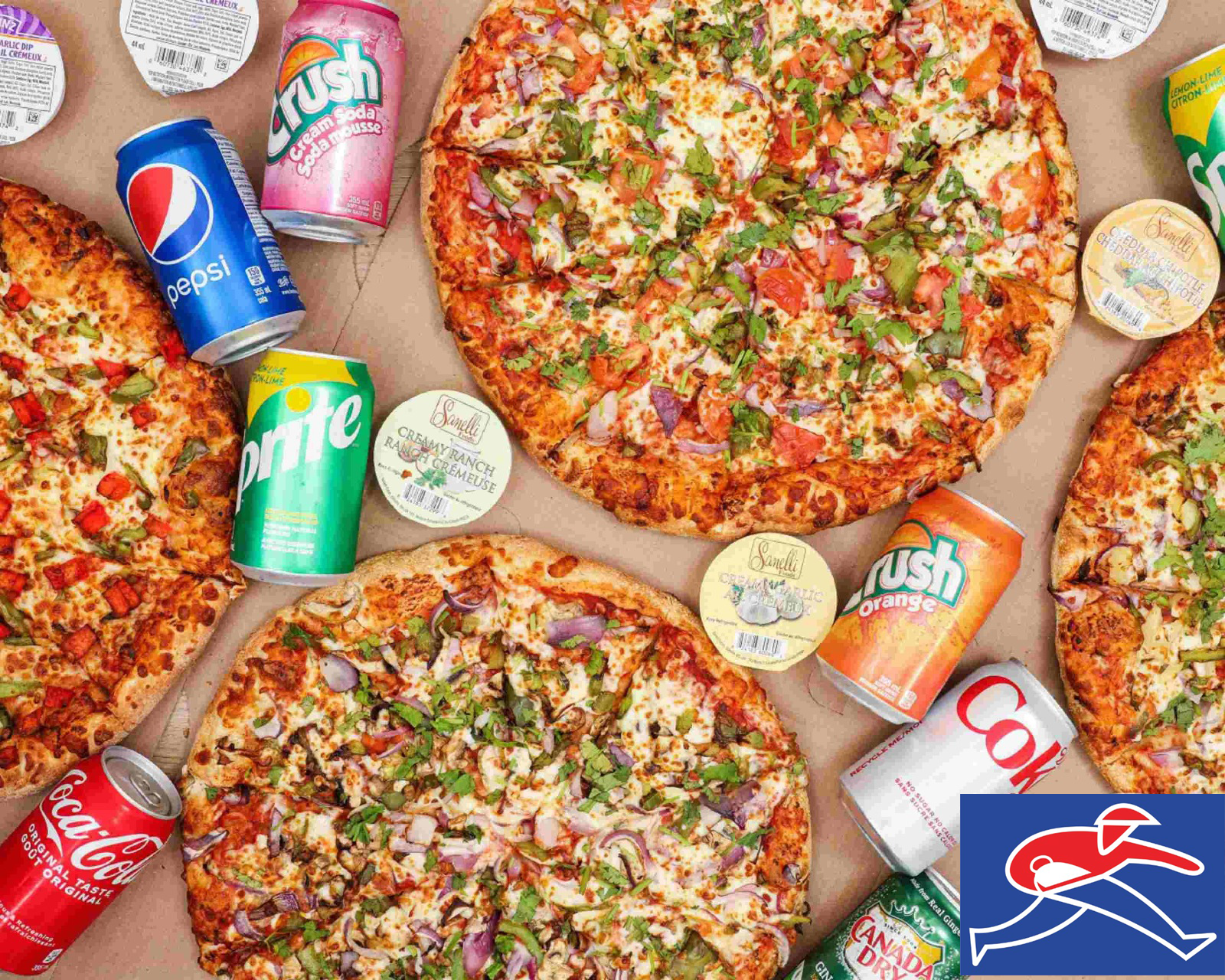 There are many different types of pizzas and sodas on the table.