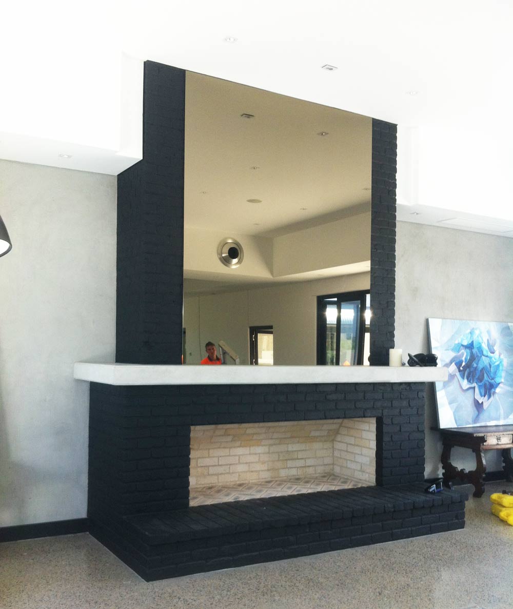large mirror above fireplace