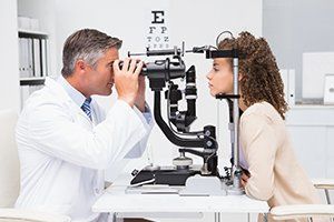 Eye Treatment — Woman doing Eye Test with Optometrist in Durango, CO
