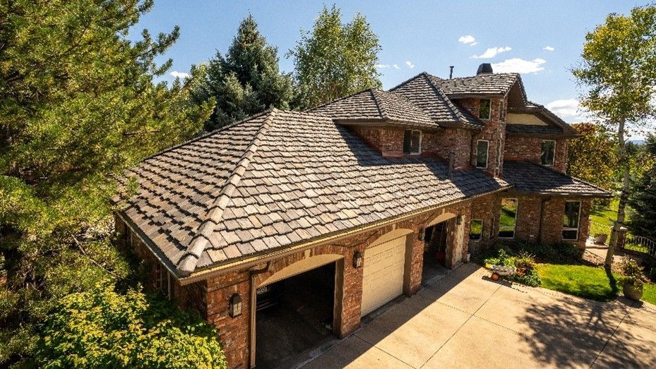 Home with new roof installed by a residential roofing contractor.