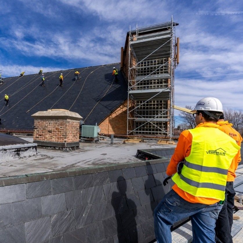 Formula roofing workers installing roof