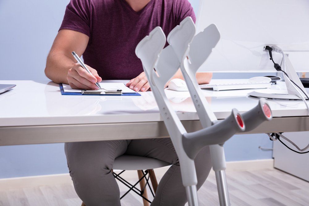 Injured Man Filling Out Form — Oregon — Smith Morgan LLP