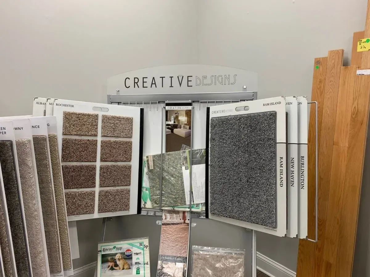 There are many different types of carpets on display in this room.