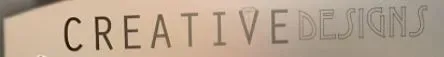 A blurred image of the word creative on a wall