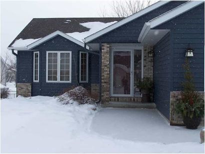 Steel Siding with snow - downspouts in Owatonna