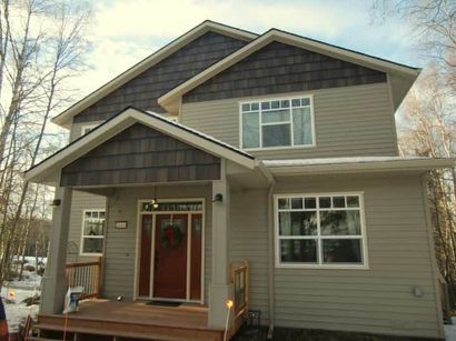 Metal roof that has a small slant - siding repair in Owatonna, MN