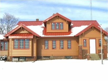 Metal roof that has a small slant - siding repairing Owatonna, MN