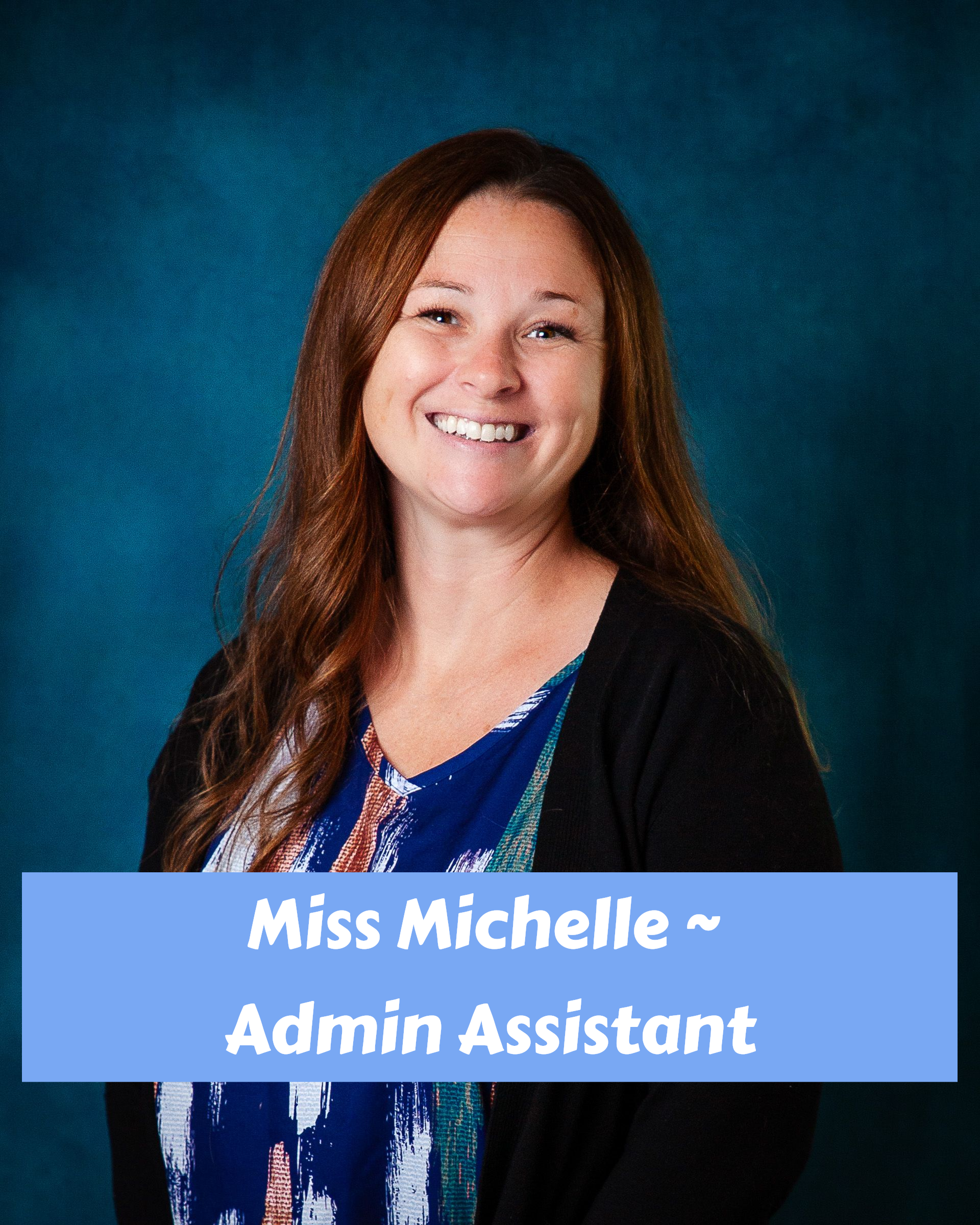 A woman with long blonde hair is smiling for the camera
