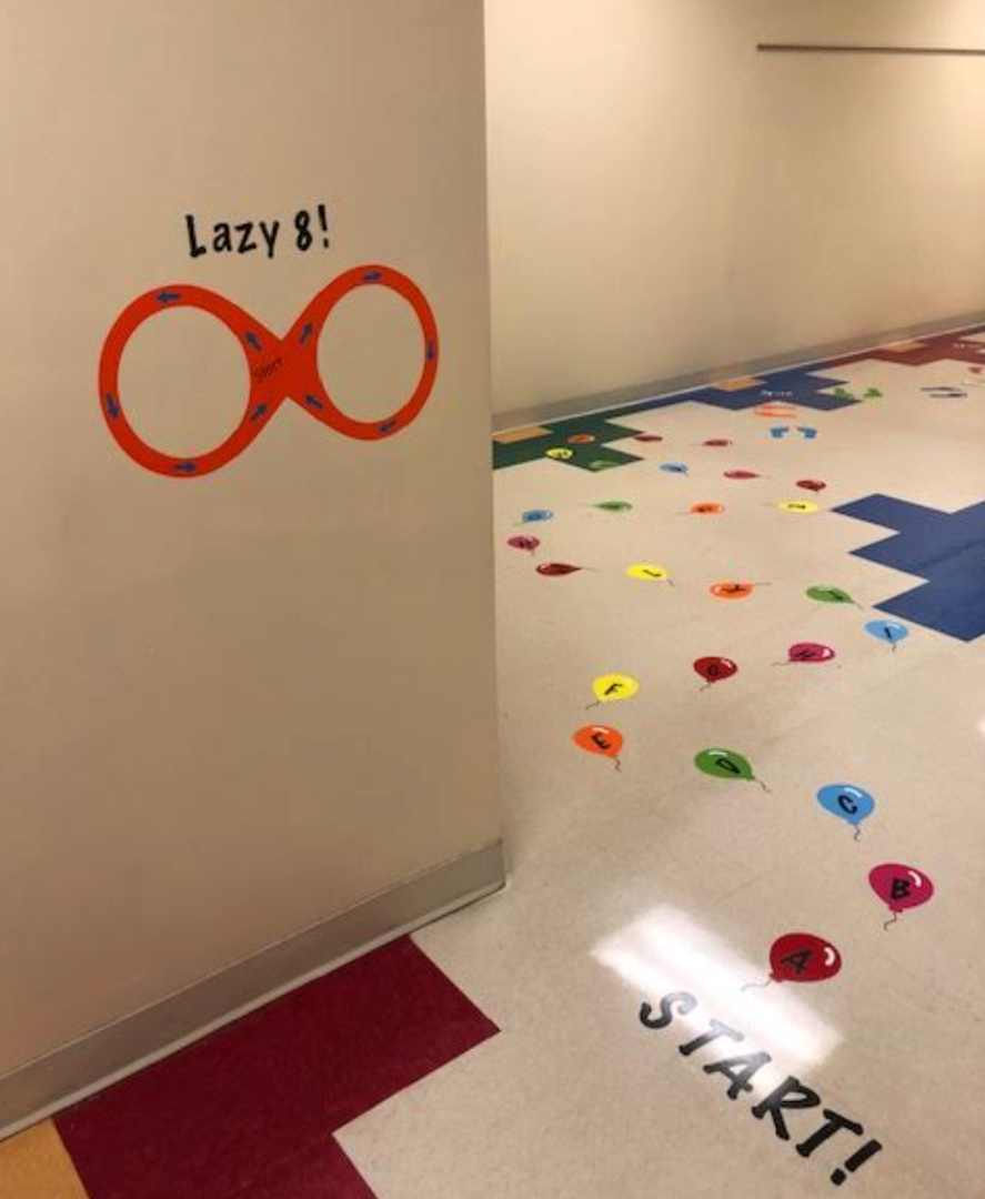 A wall with an infinity symbol and the words lazy 8 on it