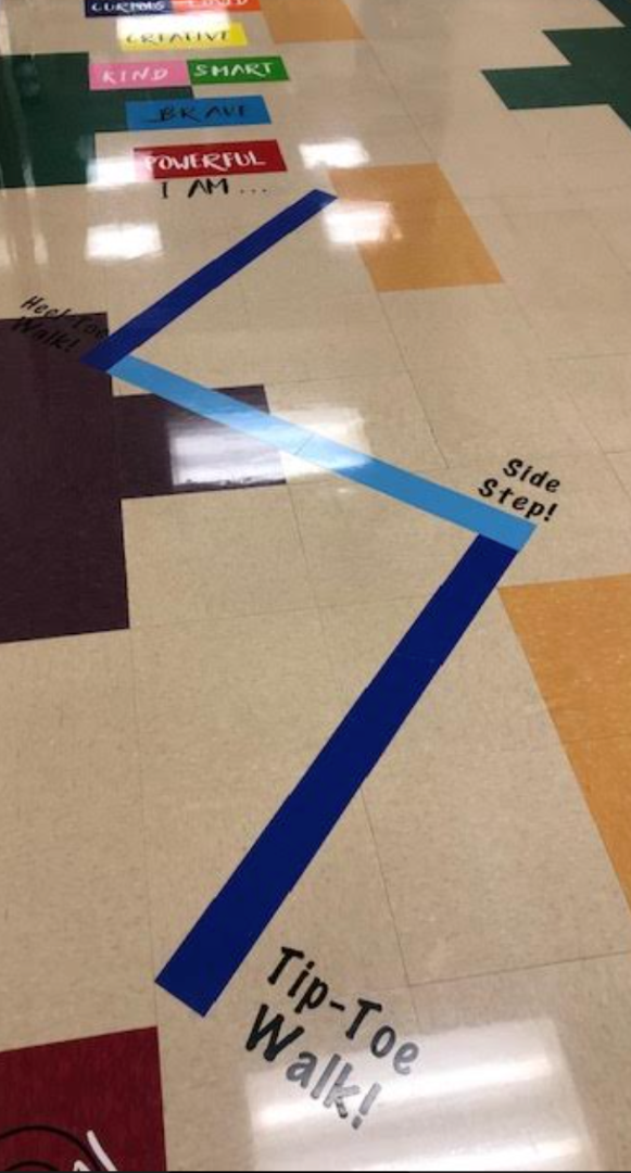 A tip-toe walk is written on the floor